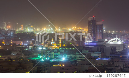Aerial view over Port Rashid illuminated at night during sand storm timelapse in Dubai, United Arab Emirates 139207445