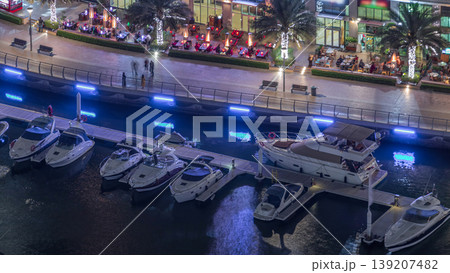 Waterfront promenade in Dubai Marina aerial night timelapse. Dubai, United Arab Emirates 139207482