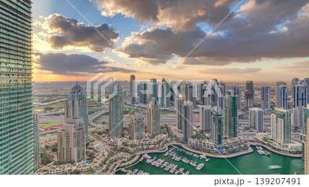 Dubai Marina skyscrapers and jumeirah lake towers view from the top aerial timelapse in the United Arab Emirates. Dubai Marina skyscrapers and jumeirah lake towers view from the top aerial timelapse in the United Arab Emirates. 139207491