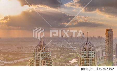 Dubai Marina skyscrapers and jumeirah lake towers view from the top aerial timelapse in the United Arab Emirates. Dubai Marina skyscrapers and jumeirah lake towers view from the top aerial timelapse in the United Arab Emirates. 139207492
