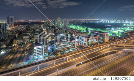 Tecom, Barsha and Greens districts aerial view from Internet city night timelapse 139207506