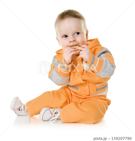 little child eating bagel 139207790