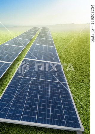 Rows of solar panels installed on a vibrant green field under a clear, bright sky, representing clean and renewable energy technology for a sustainable future Rows of solar panels installed on a vibrant green field under a clear, bright sky, representing clean and renewable energy technology for a sustainable future 139208254