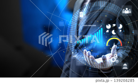 A businessman interacting with a glowing digital hologram displaying bar charts, pie graphs, and risk assessment indicators for advanced data analysis and growth forecasting A businessman interacting with a glowing digital hologram displaying bar charts, pie graphs, and risk assessment indicators for advanced data analysis and growth forecasting 139208285