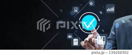 A professional businessman pointing at a blue checkmark icon, representing quality assurance, standard compliance, and business performance tracking through a digital interface 139208302