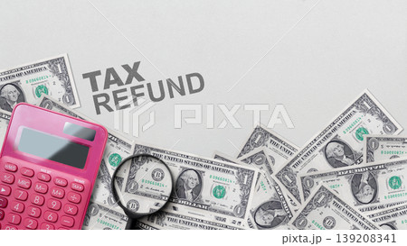 Conceptual image for tax refund. Top view of US one dollar banknotes, pink calculator, and magnifying glass on a gray background with TAX REFUND text Conceptual image for tax refund. Top view of US one dollar banknotes, pink calculator, and magnifying glass on a gray background with TAX REFUND text 139208341