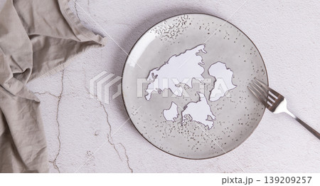 Concept of world hunger, empty plate and fork on the table top view web banner 139209257