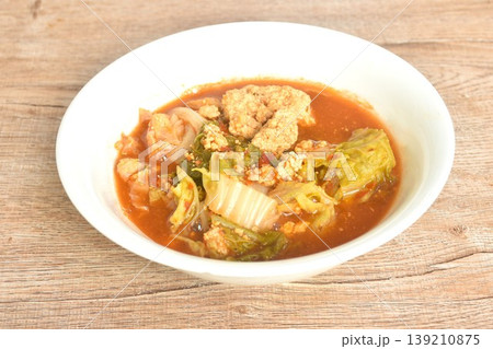 boiled mixed vegetable and fish egg in Thai spicy curry soup on bowl boiled mixed vegetable and fish egg in Thai spicy curry soup on bowl 139210875