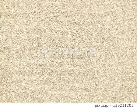 soft beige fleece texture closeup with subtle blue accents evoking cozy serenity for wallpaper or banner background soft beige fleece texture closeup with subtle blue accents evoking cozy serenity for wallpaper or banner background 139211203