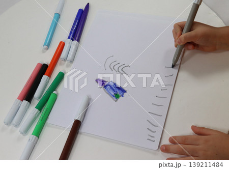 child's hands draw with the brush child's hands draw with the brush 139211484