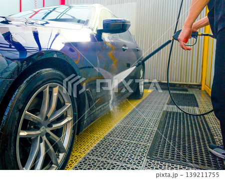 Car wash at a self-service car wash. Car wash concept Car wash at a self-service car wash. Car wash concept 139211755