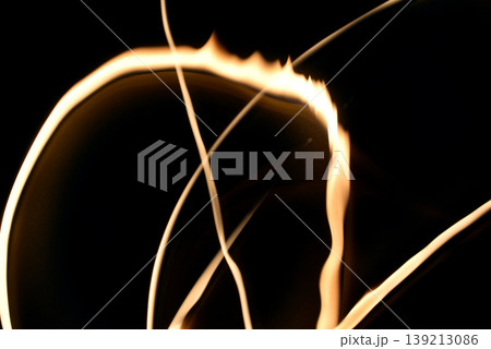 Drawing with lamplight using a long exposure on a black background. Drawing with lamplight using a long exposure on a black background. 139213086