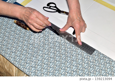 The cutter works with fabric and patterns. The cutter works with fabric and patterns. 139213094