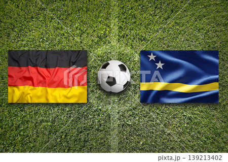 Germany vs. Curacao flags on a soccer field Germany vs. Curacao flags on a soccer field 139213402