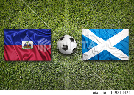 Haiti vs. Scotland flags on a soccer field 139213426
