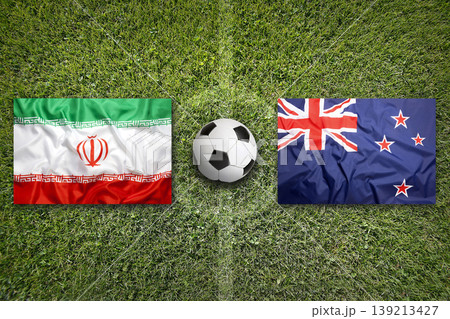 Iran vs. New Zealand flags on a soccer field 139213427