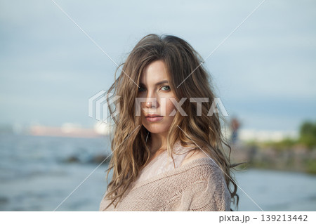 Gorgeous natural beauty young woman standing against nature background outdoors 139213442
