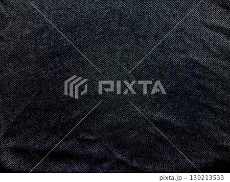 dark blue denim texture closeup intricate weave patterns subtle folds rugged fabric evoking industrial elegance fashion background dark blue denim texture closeup intricate weave patterns subtle folds rugged fabric evoking industrial elegance fashion background 139213533