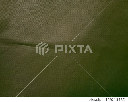 olive green textured fabric closeup subtle wrinkle abstract material backdrop minimalist moody surface olive green textured fabric closeup subtle wrinkle abstract material backdrop minimalist moody surface 139213585