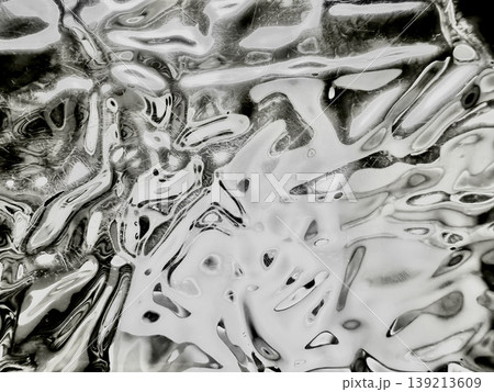 crumpled metallic foil abstract texture shimmering black white waves fluid patterns twisting ethereal closeup crumpled metallic foil abstract texture shimmering black white waves fluid patterns twisting ethereal closeup 139213609