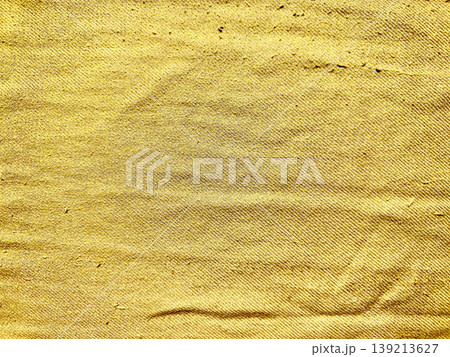 golden burlap folds with undulating wrinkles showcasing coarse weave and subtle shadow gradients golden burlap folds with undulating wrinkles showcasing coarse weave and subtle shadow gradients 139213627