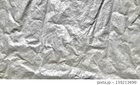crumpled silver foil texture shimmering with intricate wrinkles abstract metallic background for creative designs 139213690