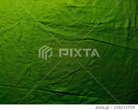 vibrant emerald corduroy fabric ripples with deep wrinkles evoking tactile depth and subtle shadows in abstract closeup vibrant emerald corduroy fabric ripples with deep wrinkles evoking tactile depth and subtle shadows in abstract closeup 139213759