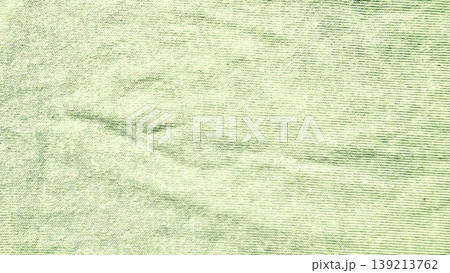crumpled pale green paper napkin texture revealing subtle wrinkles and ribbed horizontal patterns in soft closeup 139213762