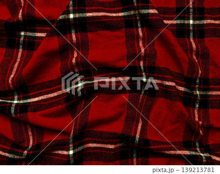 vibrant crimson tartan cloth wrinkles elegantly showcasing interwoven black emerald white stripes in textured macro composition vibrant crimson tartan cloth wrinkles elegantly showcasing interwoven black emerald white stripes in textured macro composition 139213781