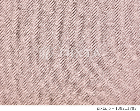 soft beige knit fabric texture closeup radiating cozy warmth with intricate weave patterns in neutral earthy tones 139213785