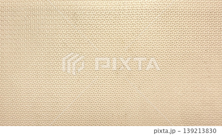 beige woven fabric texture closeup subtle bumpy pattern warm neutral tones captivating background for design projects advertising web social media 139213830