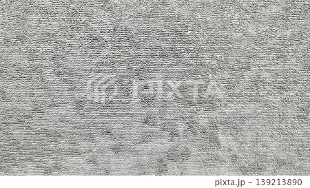 gray shag carpet closeup texture plush fuzzy fibers wavy patterns neutral cozy vibe home interior surface detail 139213890