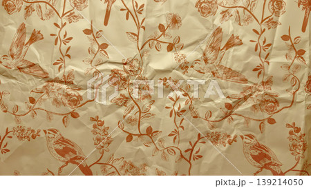 vintage crumpled bird and rose pattern on beige paper texture featuring flying sparrows amid blooming vines in sepia tones vintage crumpled bird and rose pattern on beige paper texture featuring flying sparrows amid blooming vines in sepia tones 139214050