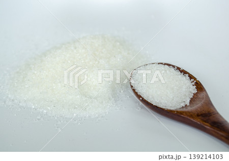 Top view of close up of salt on wooden spoon with white cover background. Health and food concept. 139214103