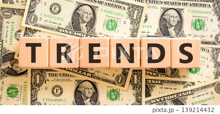 Trends trend word symbol. Concept word Trends on beautiful wooden blocks. Beautiful dollar bills background. Beautiful dollar bills. Business trends trend word concept. Copy space. Trends trend word symbol. Concept word Trends on beautiful wooden blocks. Beautiful dollar bills background. Beautiful dollar bills. Business trends trend word concept. Copy space. 139214432