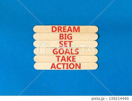 Dream big take action words symbol. Concept words Dream big Set goals Take action on beautiful wooden sticks. Beautiful blue background. Business Dream big Set goals Take action concept. Copy space. 139214440