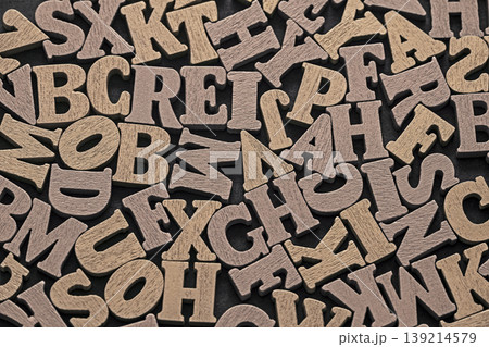 Pile of old vintage wooden letters. Typography background composition. Pile of old vintage wooden letters. Typography background composition. 139214579