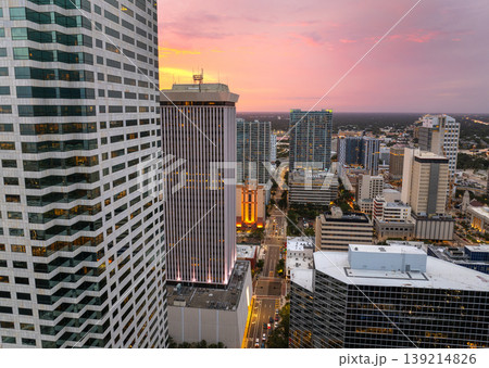 Tampa city in Florida with brightly illuminated skyscraper buildings in downtown district. American megapolis with business financial district at sunset. Tampa city in Florida with brightly illuminated skyscraper buildings in downtown district. American megapolis with business financial district at sunset. 139214826