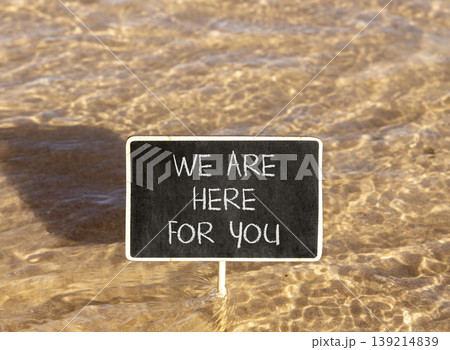 Support, help and we are here for you symbol. Concept words We are here for you on beautiful blackboard. Beautiful Red sea water background. Business we are here for you concept. Copy space. Support, help and we are here for you symbol. Concept words We are here for you on beautiful blackboard. Beautiful Red sea water background. Business we are here for you concept. Copy space. 139214839