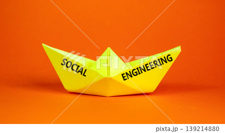 Social engineering words symbol. Concept words Social engineering on beautiful yellow paper boat. Beautiful orange background. Business and Social engineering words concept. Copy space. Social engineering words symbol. Concept words Social engineering on beautiful yellow paper boat. Beautiful orange background. Business and Social engineering words concept. Copy space. 139214880
