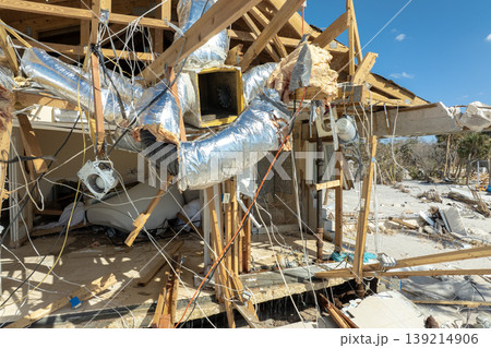 Storm surge caused by hurricane wind severe damaged residential houses on ocean shore. Natural disaster consequences in Florida 139214906