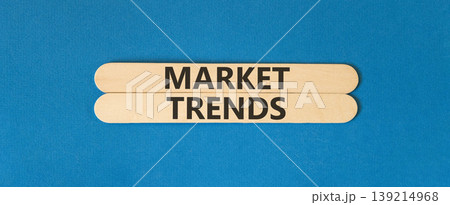 Market trends words symbol. Concept words Market trends on beautiful wooden sticks. Beautiful blue background. Business and Market trends words concept. Copy space. 139214968