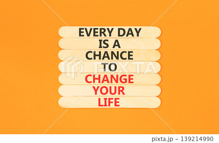 Change your life symbol. Concept words Every day is a chance to change your life on beautiful wooden sticks. Beautiful orange paper background. Business change your life concept. Copy space. Change your life symbol. Concept words Every day is a chance to change your life on beautiful wooden sticks. Beautiful orange paper background. Business change your life concept. Copy space. 139214990