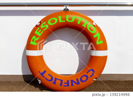 Resolution and conflict symbol. Concept words Resolution and Conflict on beautiful orange lifebuoy. Beautiful white ship board background. Social resolution instead conflict concept. Copy space. 139214998