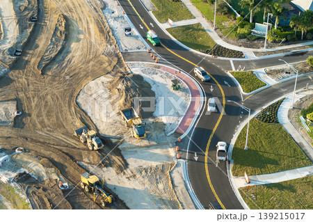 Roundabout construction roadworks on American transport infrastructure. Renovation of highway road with moving traffic. Development of interstate transportation concept Roundabout construction roadworks on American transport infrastructure. Renovation of highway road with moving traffic. Development of interstate transportation concept 139215017