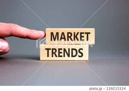 Market trends words symbol. Concept words Market trends on beautiful wooden blocks. Beautiful grey background. Businessman hand. Business and Market trends words concept. Copy space. 139215324