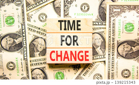 Time for change symbol. Concept words Time for change on beautiful wooden blocks. Beautiful dollar bills background. Dollar bills. Business and time for change concept. Copy space. Time for change symbol. Concept words Time for change on beautiful wooden blocks. Beautiful dollar bills background. Dollar bills. Business and time for change concept. Copy space. 139215343