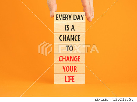 Change your life symbol. Concept words Every day is a chance to change your life on beautiful wooden blocks. Beautiful orange paper background. Business change your life concept. Copy space. Change your life symbol. Concept words Every day is a chance to change your life on beautiful wooden blocks. Beautiful orange paper background. Business change your life concept. Copy space. 139215356