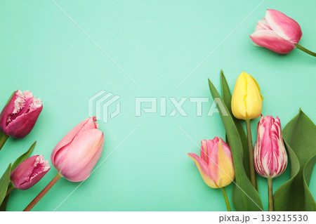 Bouquet of tulips on a mint background. Top view Bouquet of tulips on a mint background. Top view 139215530