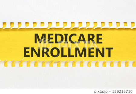 Medicare enrollment words symbol. Concept words Medicare enrollment on beautiful yellow paper. Beautiful white background. Medical and Medicare enrollment words concept. Copy space. Medicare enrollment words symbol. Concept words Medicare enrollment on beautiful yellow paper. Beautiful white background. Medical and Medicare enrollment words concept. Copy space. 139215710